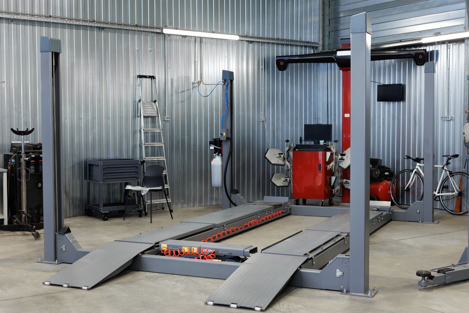 Auto repair shop with coated floor and vehicle lift