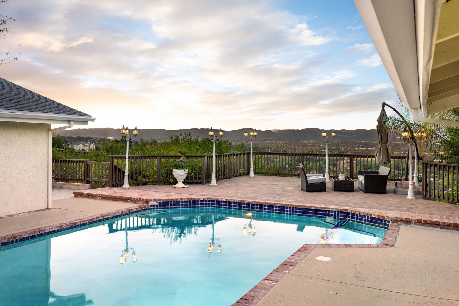 Coated backyard pool deck with a view