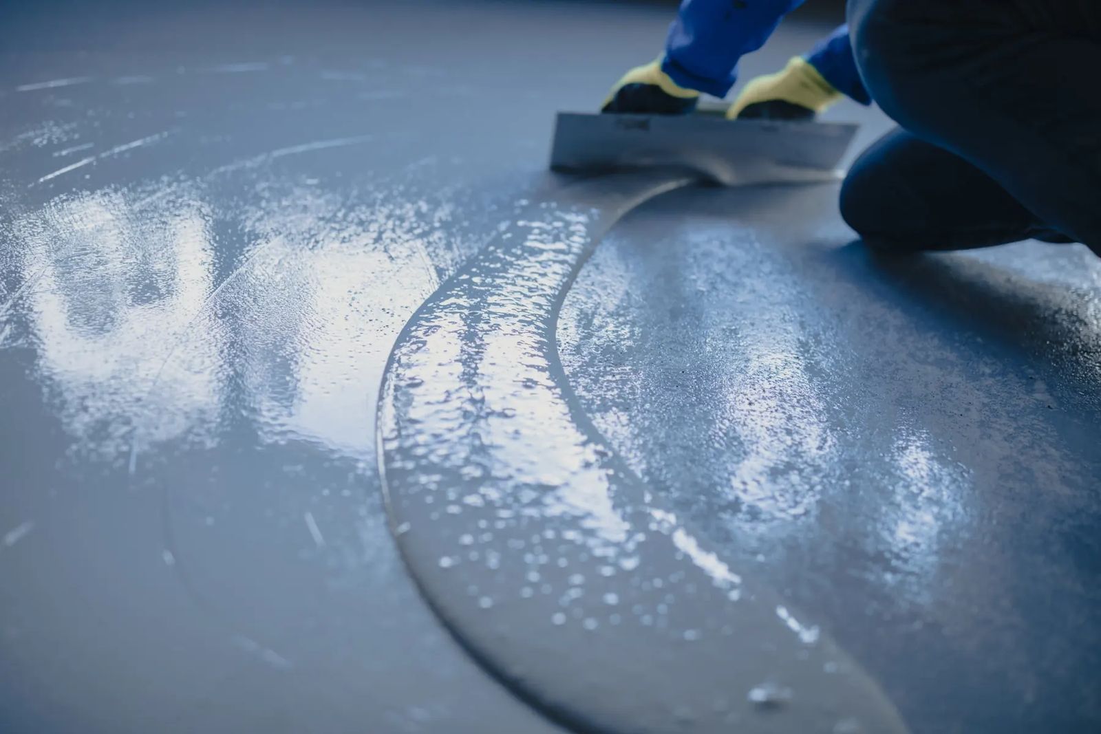 Applying a polyurea floor coating with a trowel