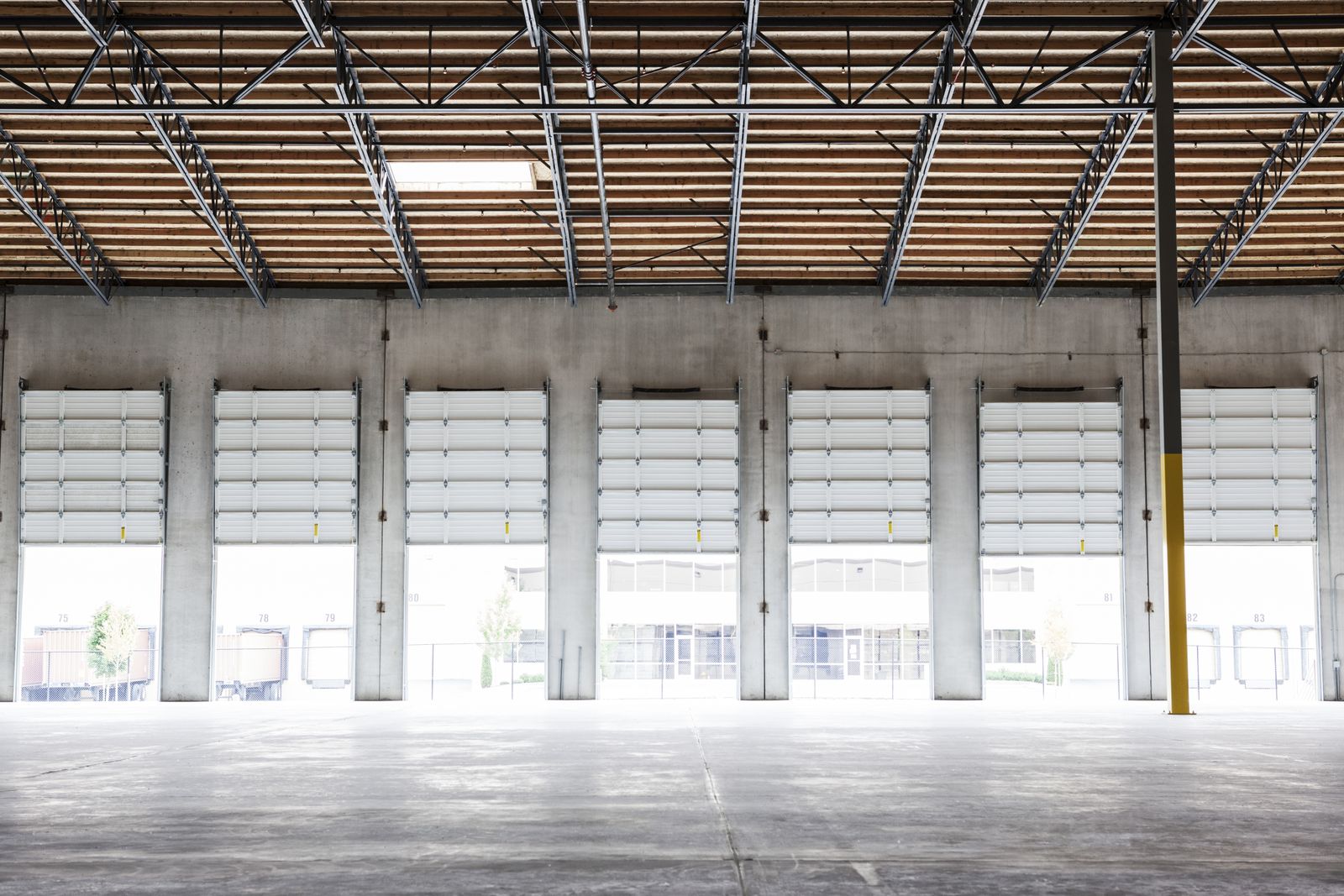 Warehouse interior with open loading dock doors